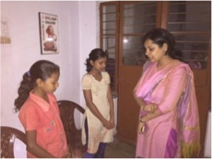 Aashima prays with rescued girls